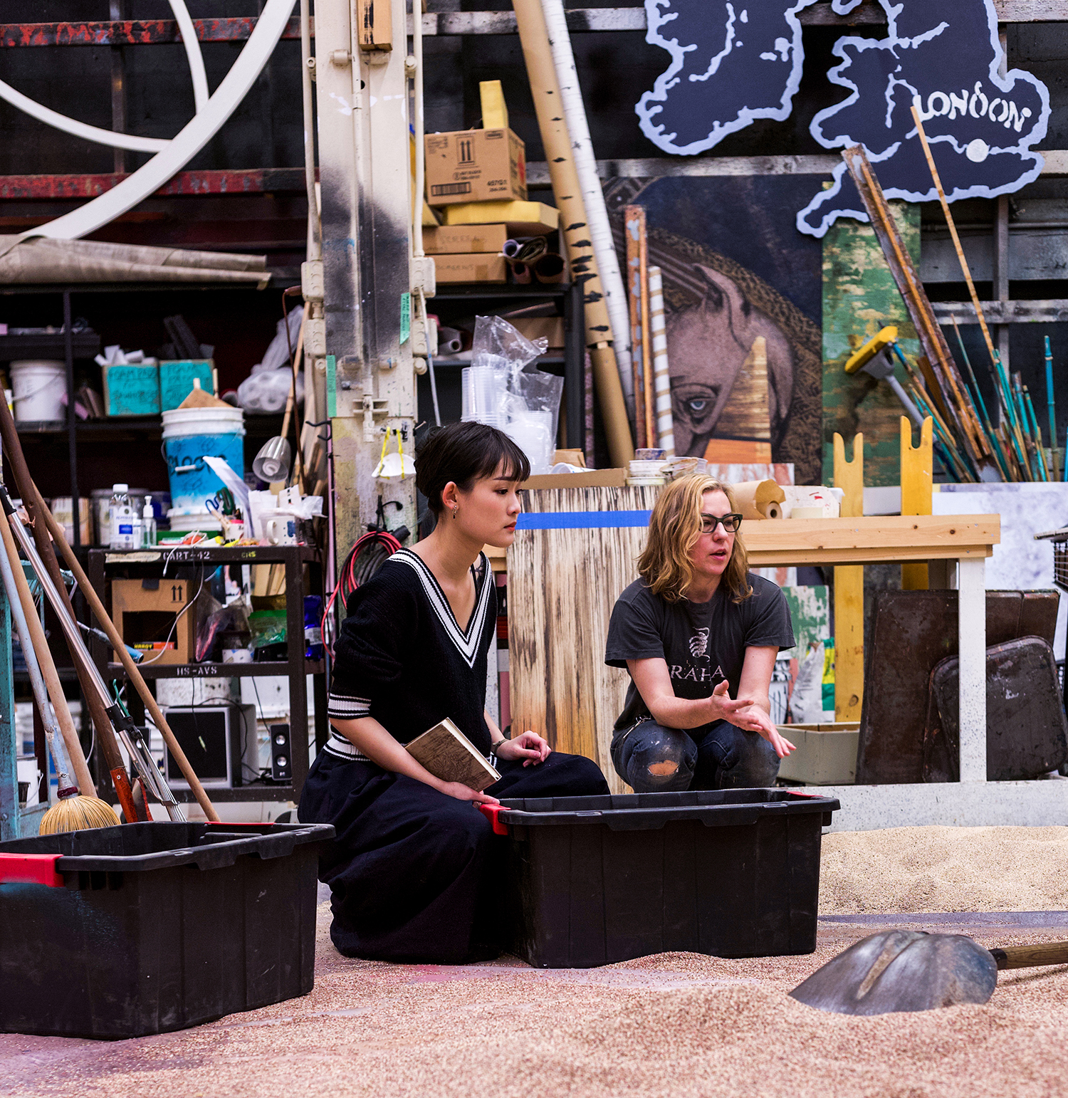 MFA Design student Shin-yi Lin consults with Scenic Artist and faculty member Jennifer Law in Drama Scene Shop