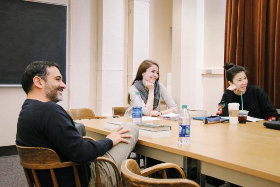Drama Ph.D. students laugh during a seminar class