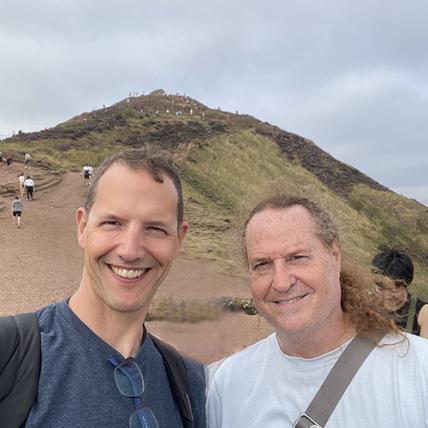 A photo of two men standing side by side