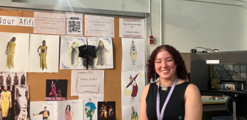 Picture of Nour in front of her artwork