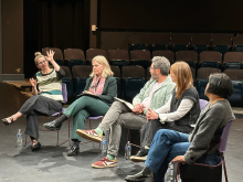 Panelists in conversation at the Glen Hughes Penthouse Theatre