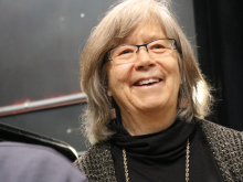 A lady smiling proudly