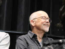 A man smiling with proudly