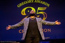 Opening Performer on Stage – A performer opens the 25th Annual Gregory Awards celebration
