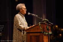 Valerie Curtis-Newton at the podium presenting an award