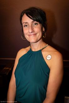 Heidi Zamora, UW Drama instructor and MFA Design 2002 alum, smiling at the 2025 Gregory Awards after being recognized for Outstanding Costume Design for Crave at Intiman Theatre.