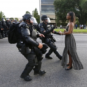 A demonstrator protesting the shooting death of Alton Sterling is detained by law enforcement near the headquarters of the Baton Rouge Police Department in Baton Rouge, La., on July 9, 2016