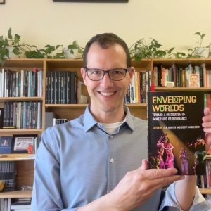 Scott Magelssen holding a book