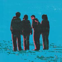 Four people walking, one looking back