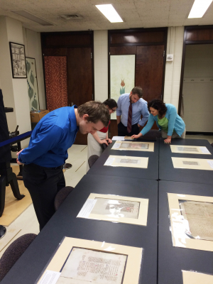 Drama PhD students look at medieval manuscripts in Special Collections.