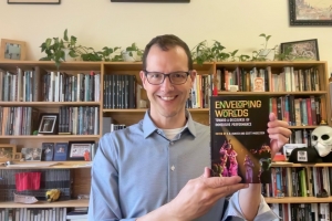 Scott Magelssen holding a book
