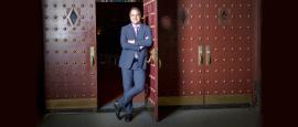David Armstrong stands at the front doors of the 5th Avenue Theater.