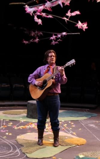 Jonathan Shue as Amiens in As You Like It