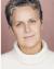 Amy Thone in white turtleneck