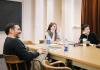 Drama Ph.D. students laugh during a seminar class
