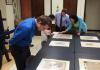Drama PhD students look at medieval manuscripts in Special Collections.