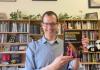 Scott Magelssen holding a book