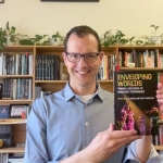 Scott Magelssen holding a book