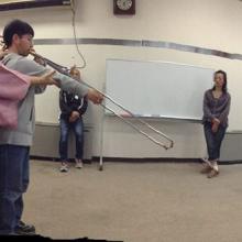 Cathy instructing a trombone player in Japan.