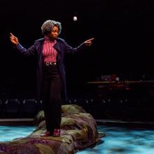 Woman talks on stage