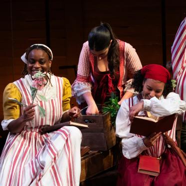 A group of  performers on stage