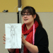Picture of Jocelyn Fowler (BA '09) with one of her costume sketches.